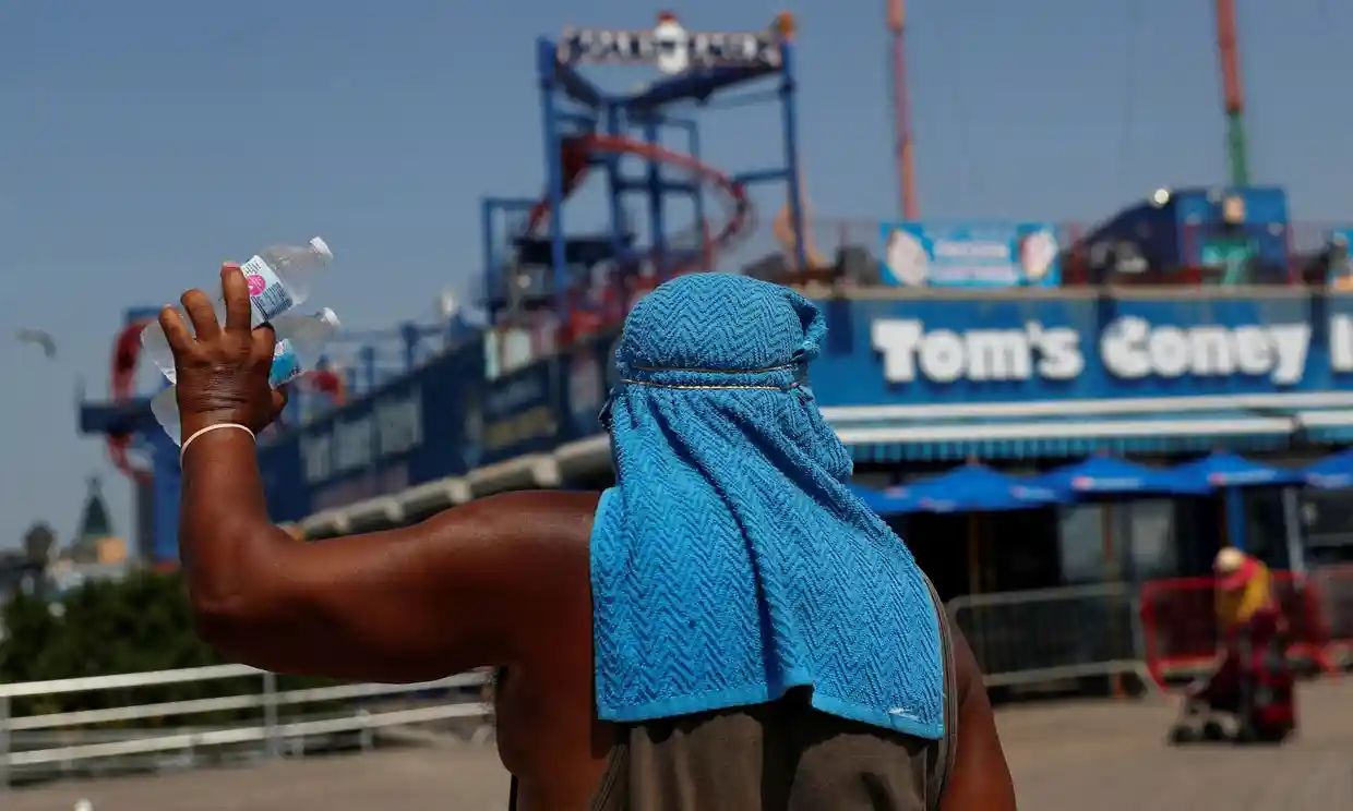 A man sells water on the Coney Island boardwalk