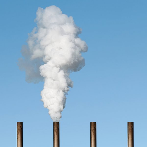 thick white smoke with blue sky