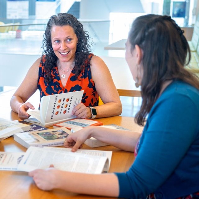Gen Meredith works with colleague Zoe Wakoff in Schurman Hall.