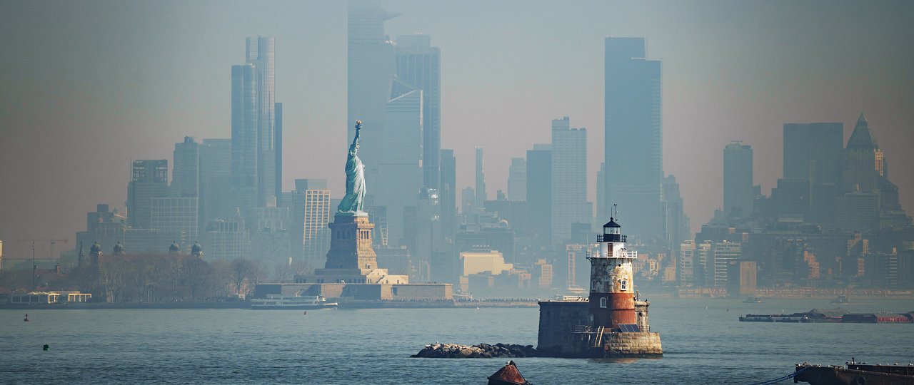 Panorama view of New York city with statue of liberty tomorrow morning at sunrise. View from Staten Island. (iStock)