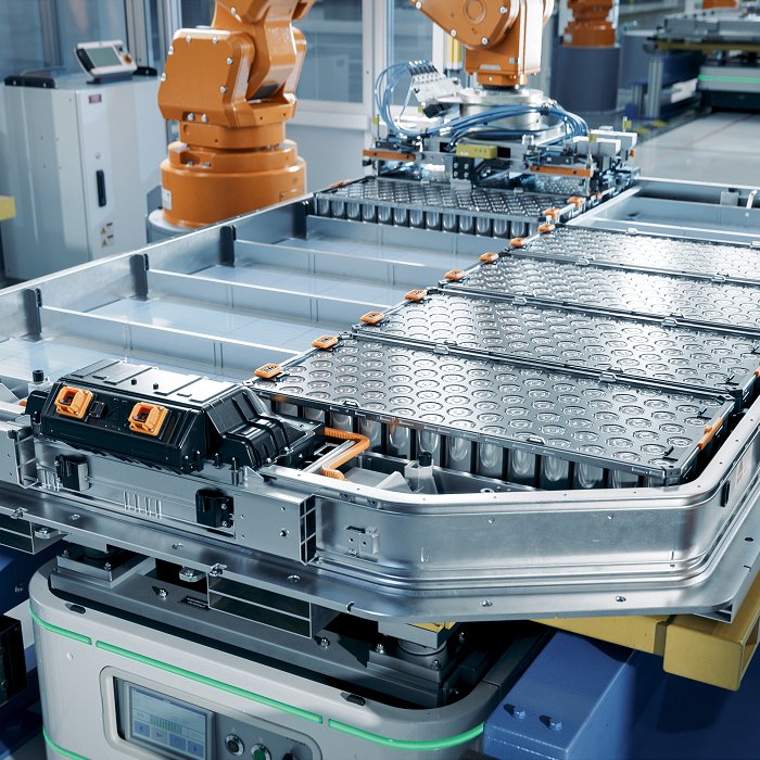 EV battery production Line with robot arms inside factory (iStock)