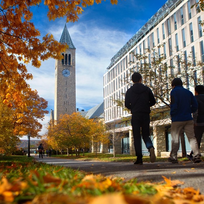 Cornell campus view with students and McGraw Tower