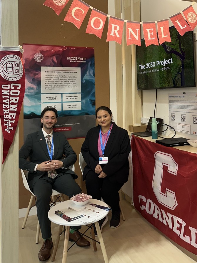 Anaya-Torres and Gonzalez helped host Cornell’s booth at COP29