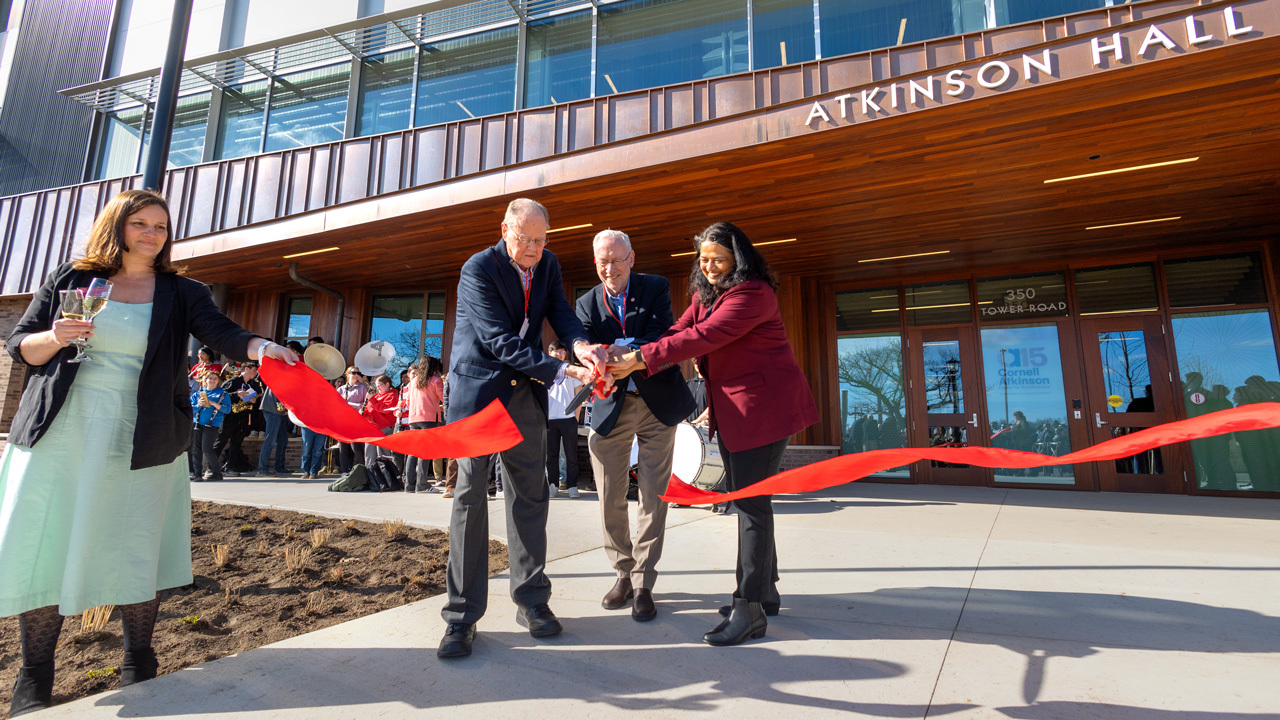 David Atkinson, President Kotlikoff, and Provost Bala cut the ribbon in front of Atkinson Hall on 4/9/2025