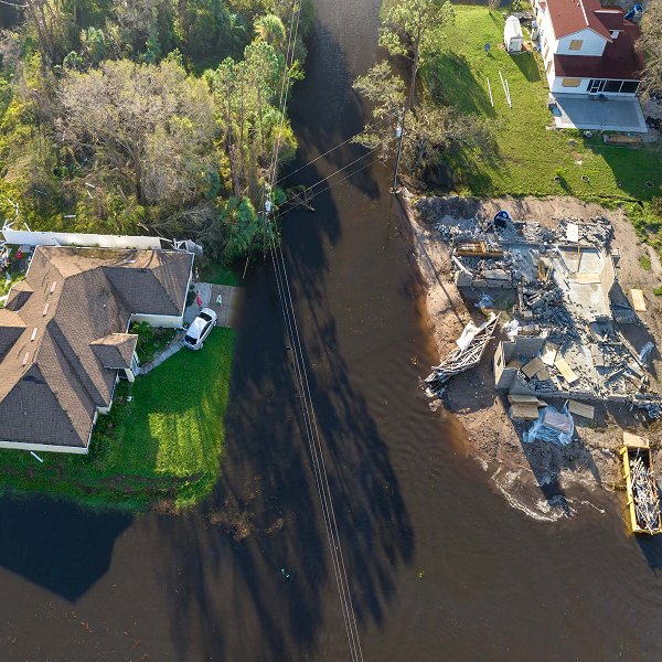 Flooding-ravaged home beside a river
