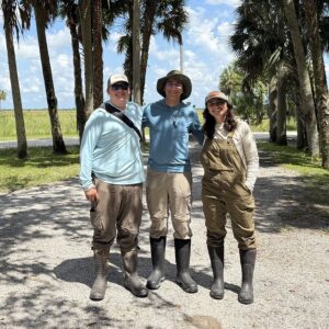 Michael Belfer ’28, Allasandra Avril Valdez, a Ph.D., Eli Barrett-Learn ’28 on ranch in Florida with Prof. Jed Sparks