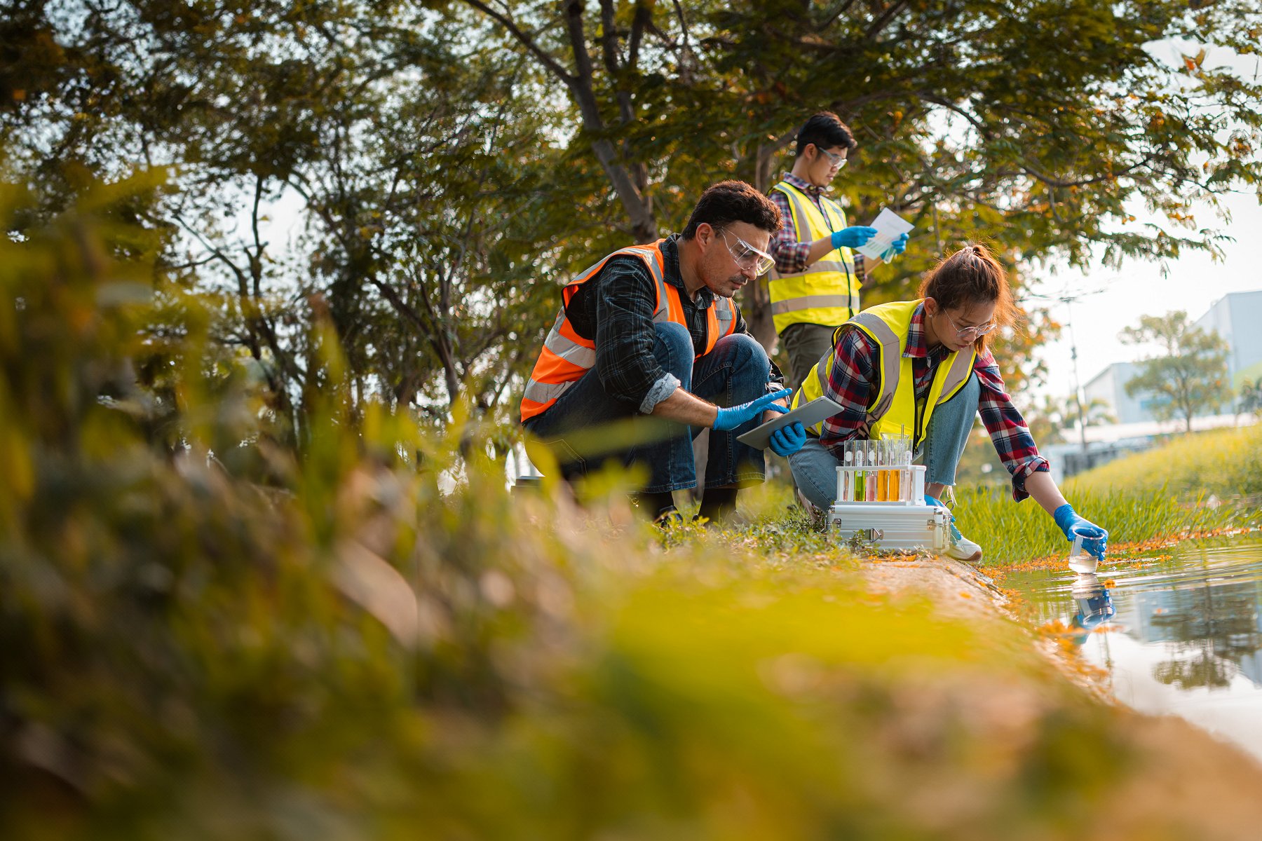 Researchers sampling water from stream